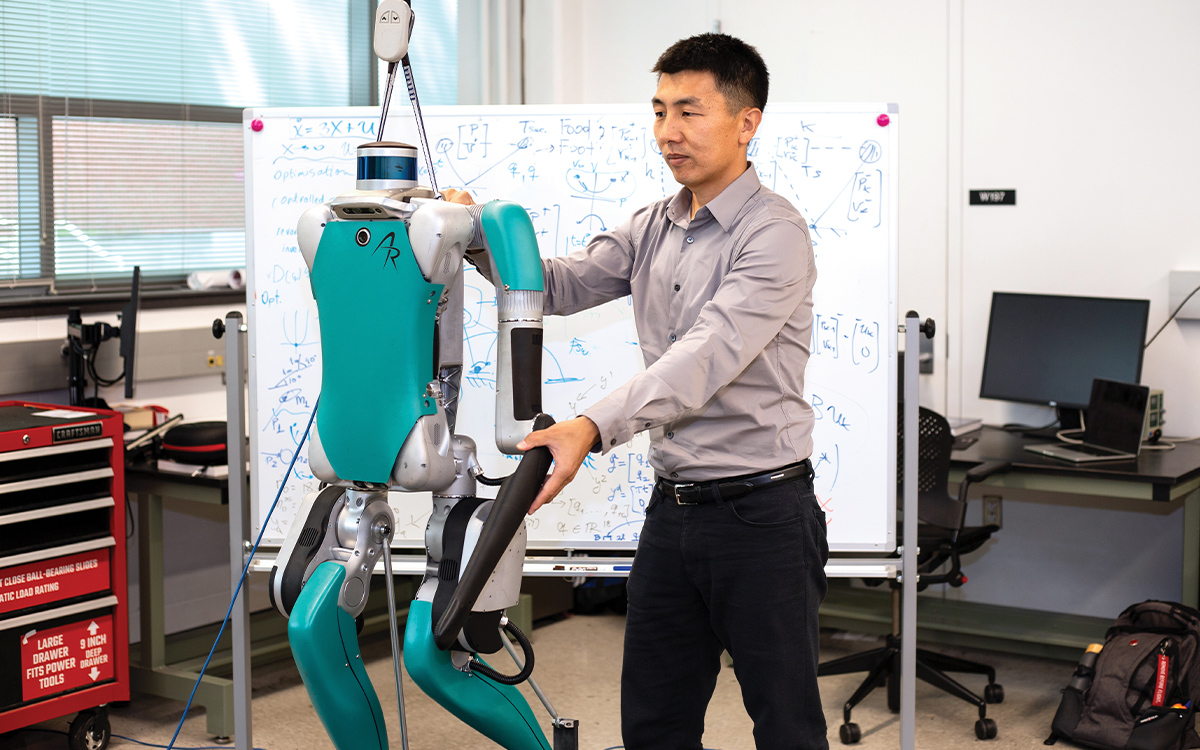 Faculty member with robot